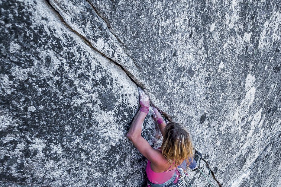 Anna Smith climbs High Plains Drifter (5.11c, 2 pitches) on the granitic Third Peak of the Stawamus Chief, Squamish, British Columbia. [Photo] John Price