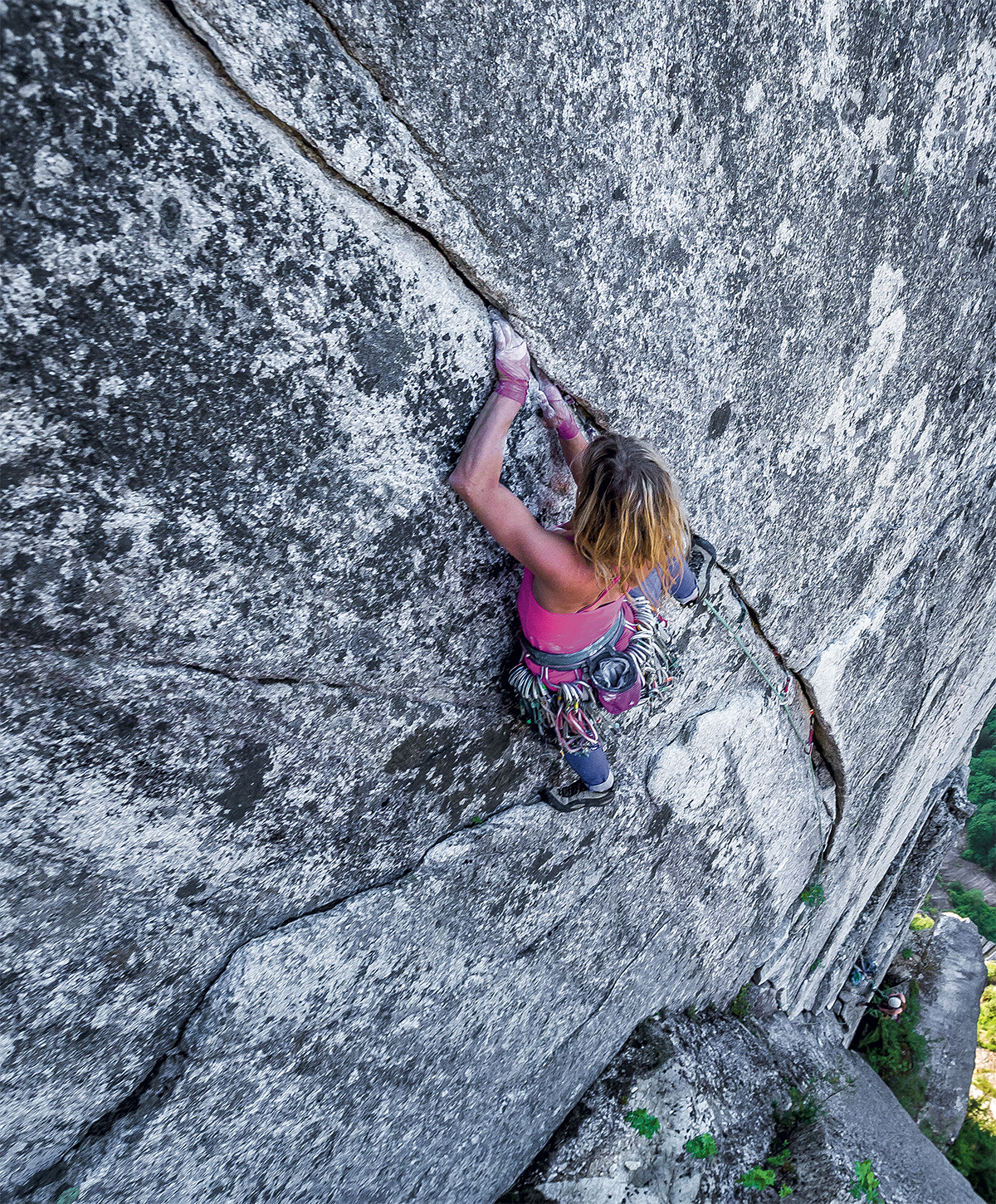 Anna Smith climbs High Plains Drifter (5.11c, 2 pitches) on the granitic Third Peak of the Stawamus Chief, Squamish, British Columbia. [Photo] John Price
