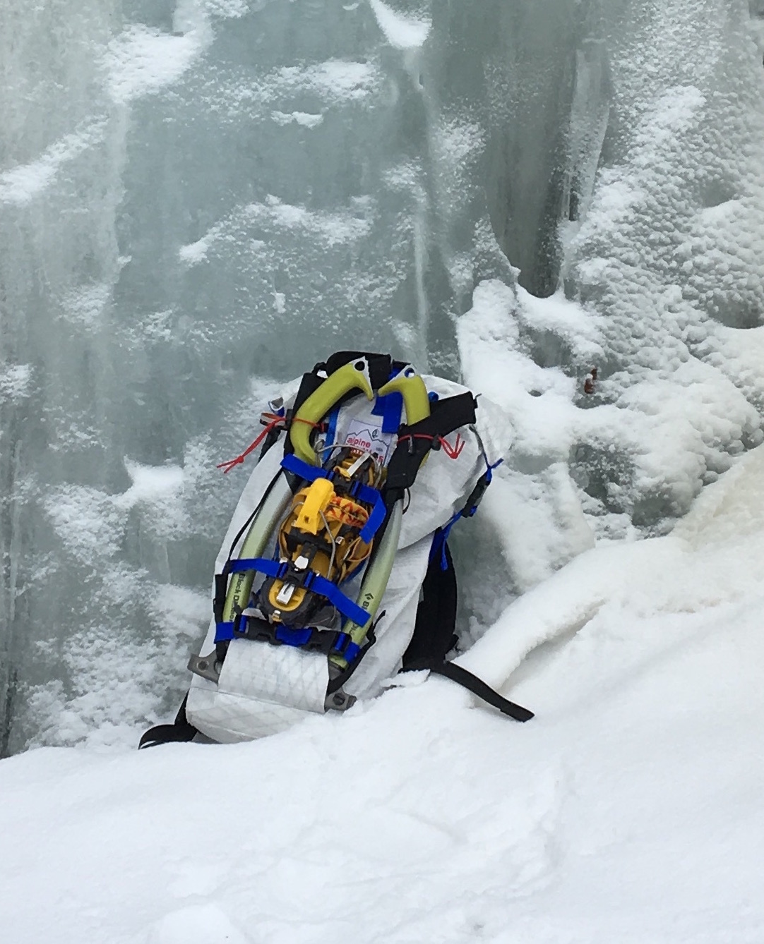 The Alpine Luddites White Light/White Heat backpack with crampons and ice tools strapped to the outside. [Photo] Paula Wright