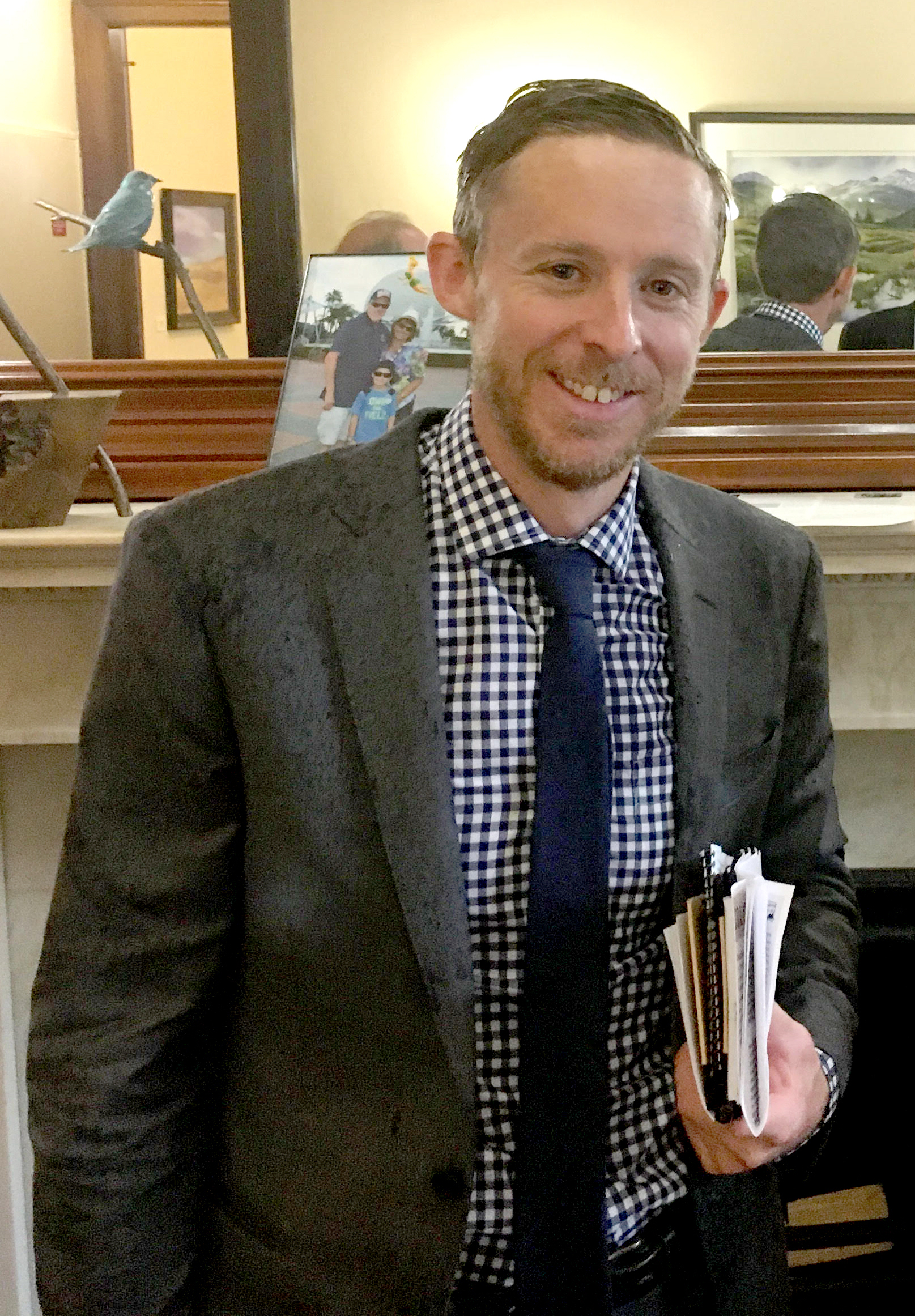Rain water drips from Caldwell's hair and suit in the Washington, DC, office of Colorado Senator Michael Bennet during the Climb the Hill Event on May 11, in which delegations of climbers lobbied Congress on behalf of public lands. [Photo] Derek Franz