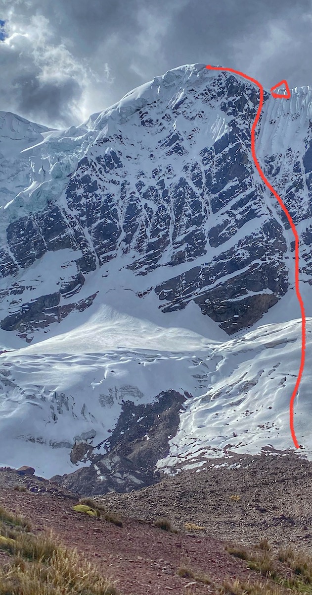 The line of Cerveza, Pan y Acido (ED: 90 degrees, 700m) on the south face of Concha de Caracol (5640m) with the location of the open bivy marked near the top. [Photo] Courtesy of Anna Pfaff