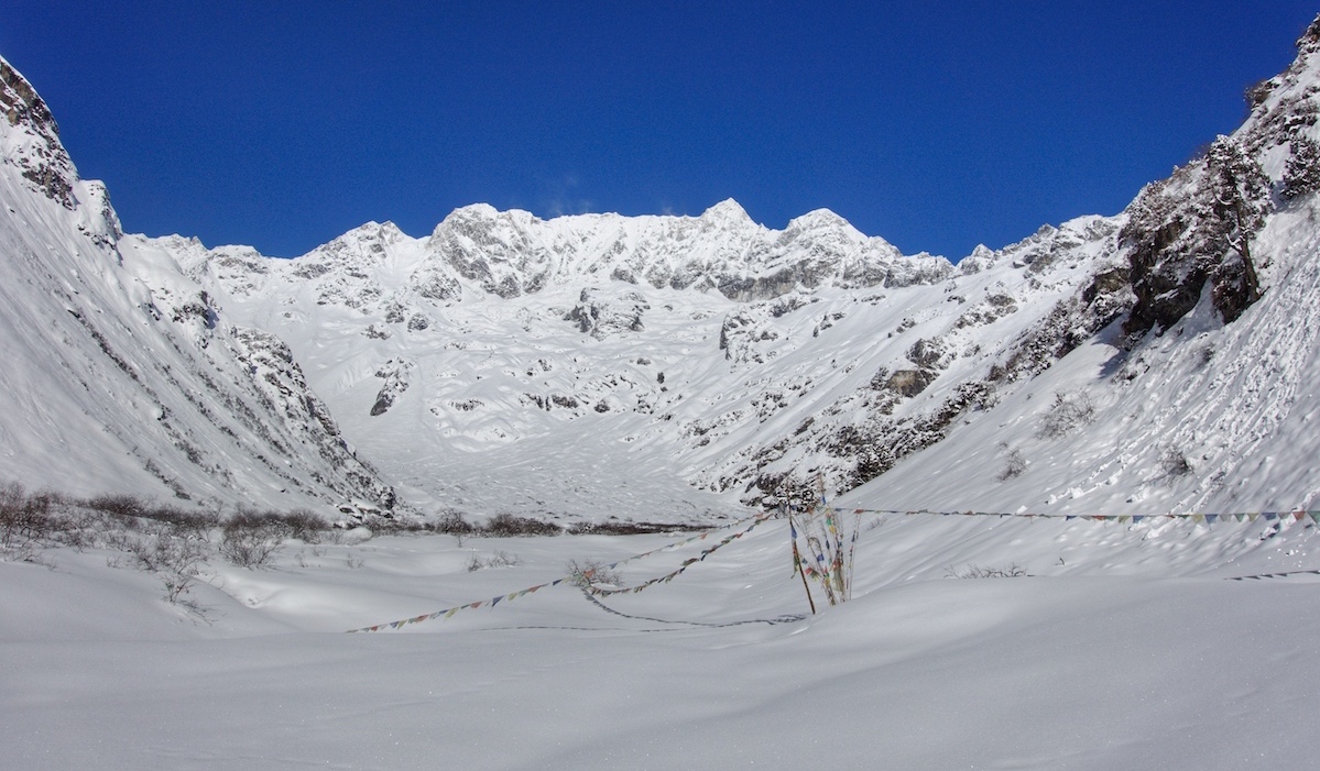 Base camp. There is normally a house where the flags are, but the building is covered by 2 meters of snow. [Photo] Benjamin Billet