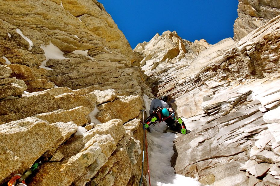 Jess Roskelley on lead through mixed terrain during the first ascent of Westman's World (VI M7 AI4X A3 70) on the Citadel (8,520') in the Kichatna Spires, Alaska. [Photo] Benjamin Erdmann