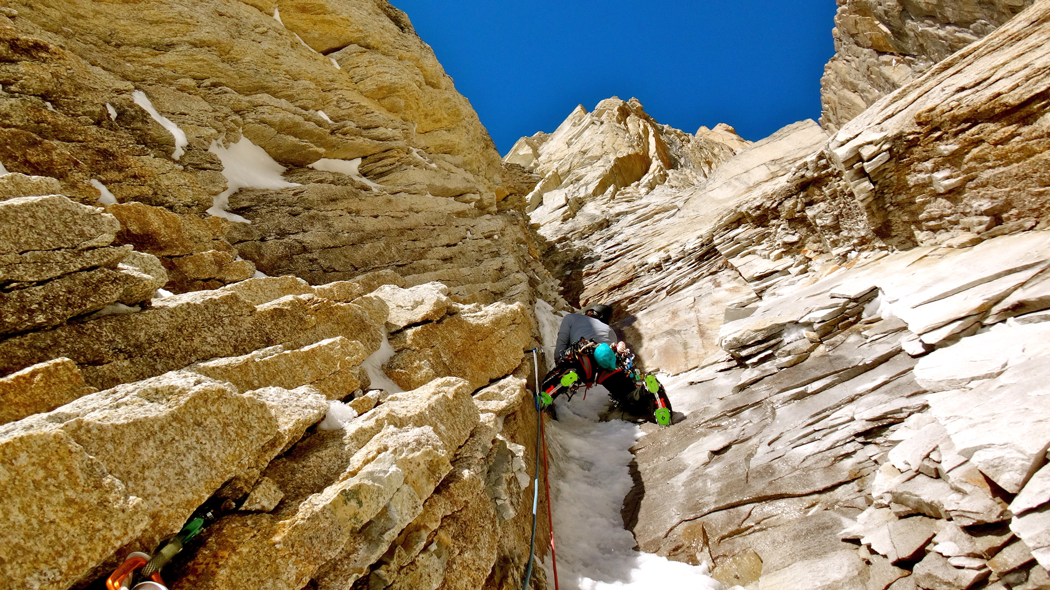 Jess Roskelley on lead through mixed terrain during the first ascent of Westman's World (VI M7 AI4X A3 70) on the Citadel (8,520') in the Kichatna Spires, Alaska. [Photo] Benjamin Erdmann