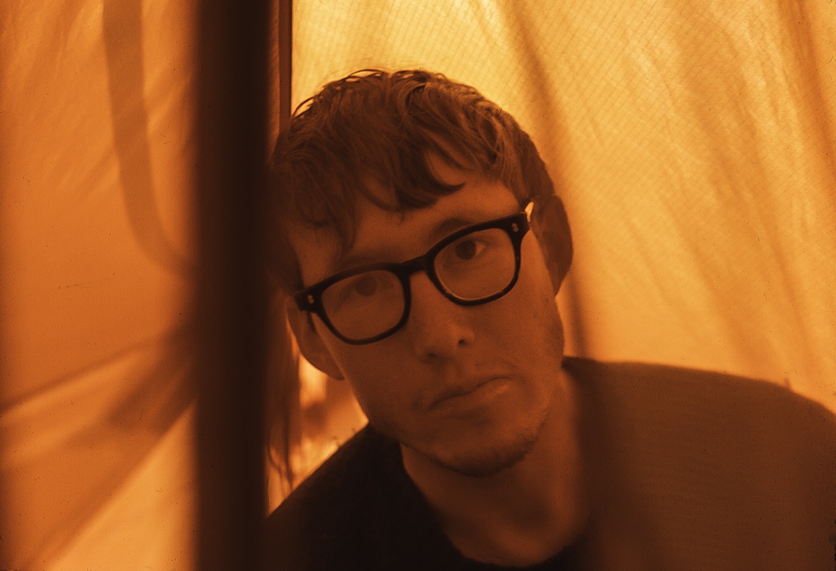 David Roberts in a tent while climbing in the Revelation Mountains, Alaska, 1967. [Photo] Matt Hale