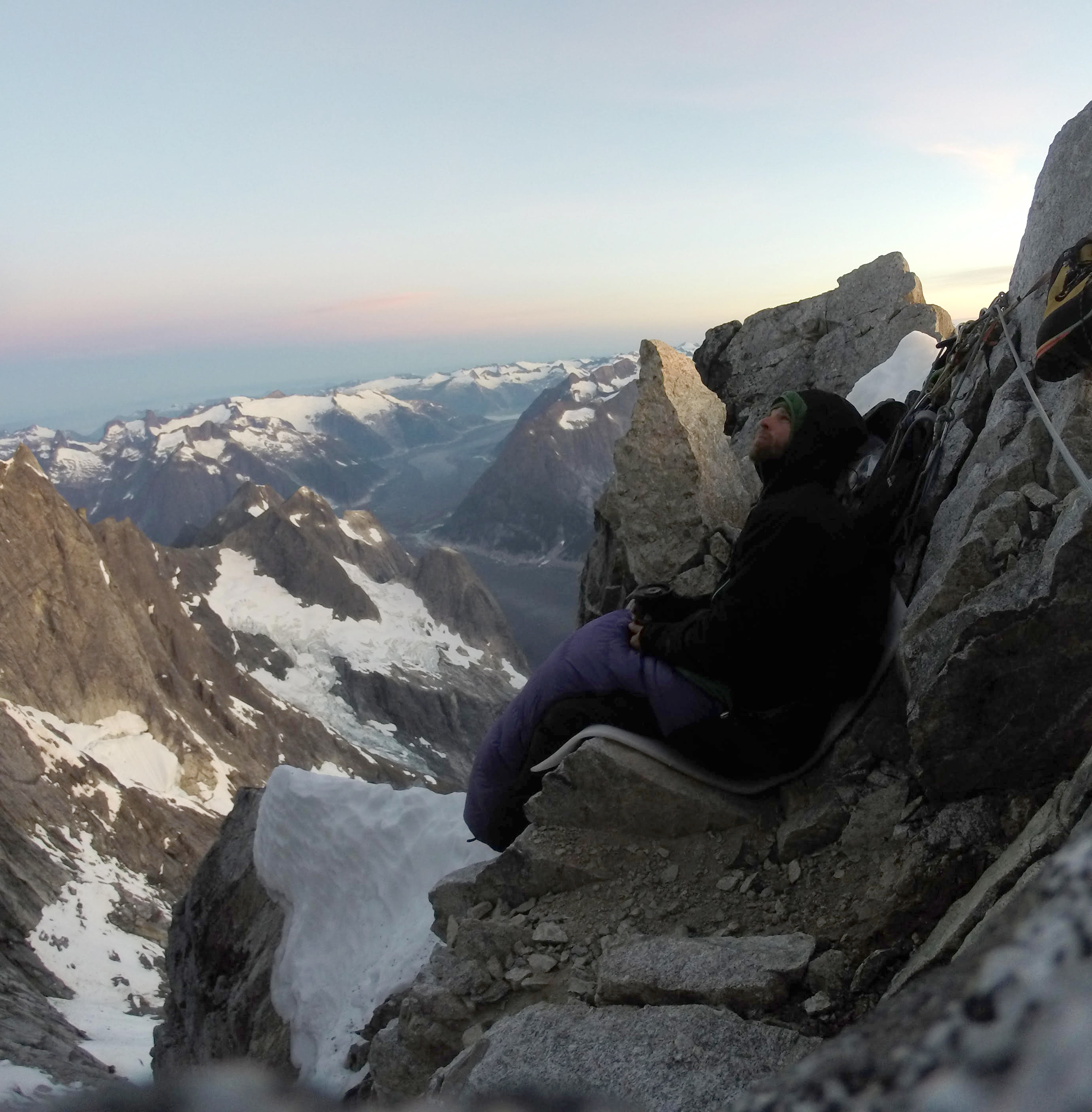 Cole Taylor at his bivy at a notch in the North Pillar, midway up the route. [Photo] Cole Taylor