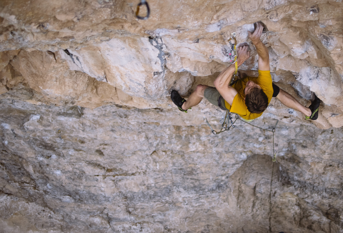 Derek Franz on Magnetar (5.13d), Rifle Mountain Park, Colorado. The Edelrid Bulletproof quickdraw is the first one clipped to the rope above the ground, near the lower right corner of the frame. The carabiner that the Bulletproof draw replaced was severely grooved. [Photo] Karissa Frye