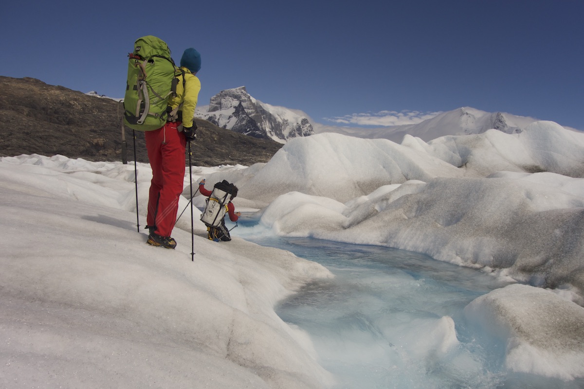 Matteo Della Bordella and David Bacci cross the 8 kilometer-wide Upsala Glacier with the east face of Cerro Murallon (ca. 2800m) in the background. [Photo] Matteo Bernasconi