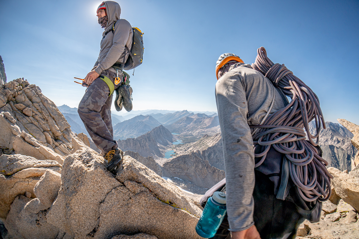A rope...and the rack in the pack on your back! The Alien's svelte design saves not only weight, but tremendously reduces the volume of gear you need to shove in your pack as well. Luke Potter and Chip Powell stash the kit and make a break for the summit of University Peak after climbing Liberal Arts. [Photo] Tad McCrea