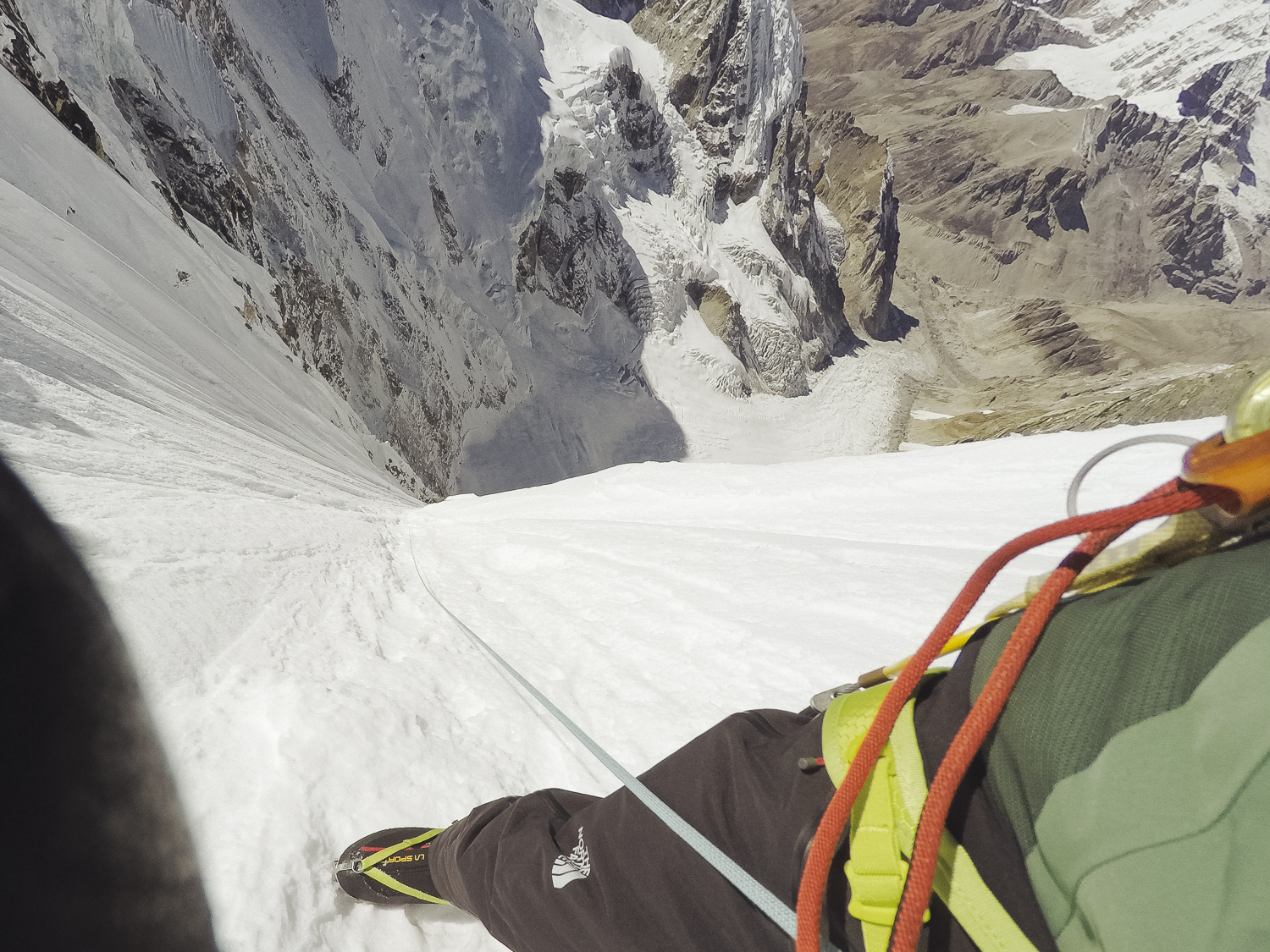 Of this photo Auer wrote, Looking down at around 6800 meters. It was already late afternoon and we were happy that we reached the sun. The wind was blowing very hard and the second night turned out to be not an easy one. [Photo] Hansjorg Auer