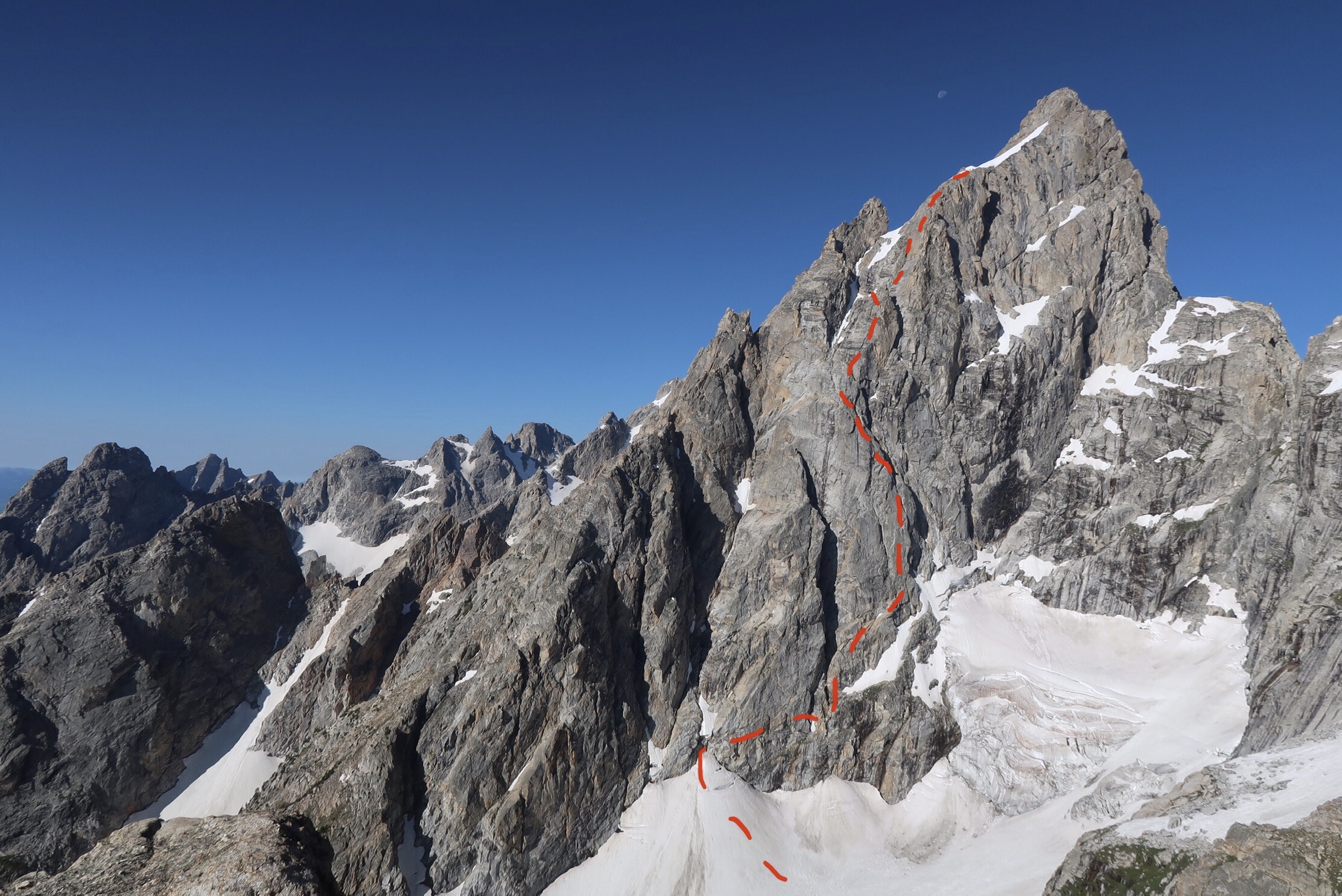 The north face of the Grand Teton with the approximate route of the North Buttress Direct drawn in red. The photo was taken from somewhere between Teewinot and Mt. Owen while on the Grand Traverse route a week earlier. [Image] Justin Bowen