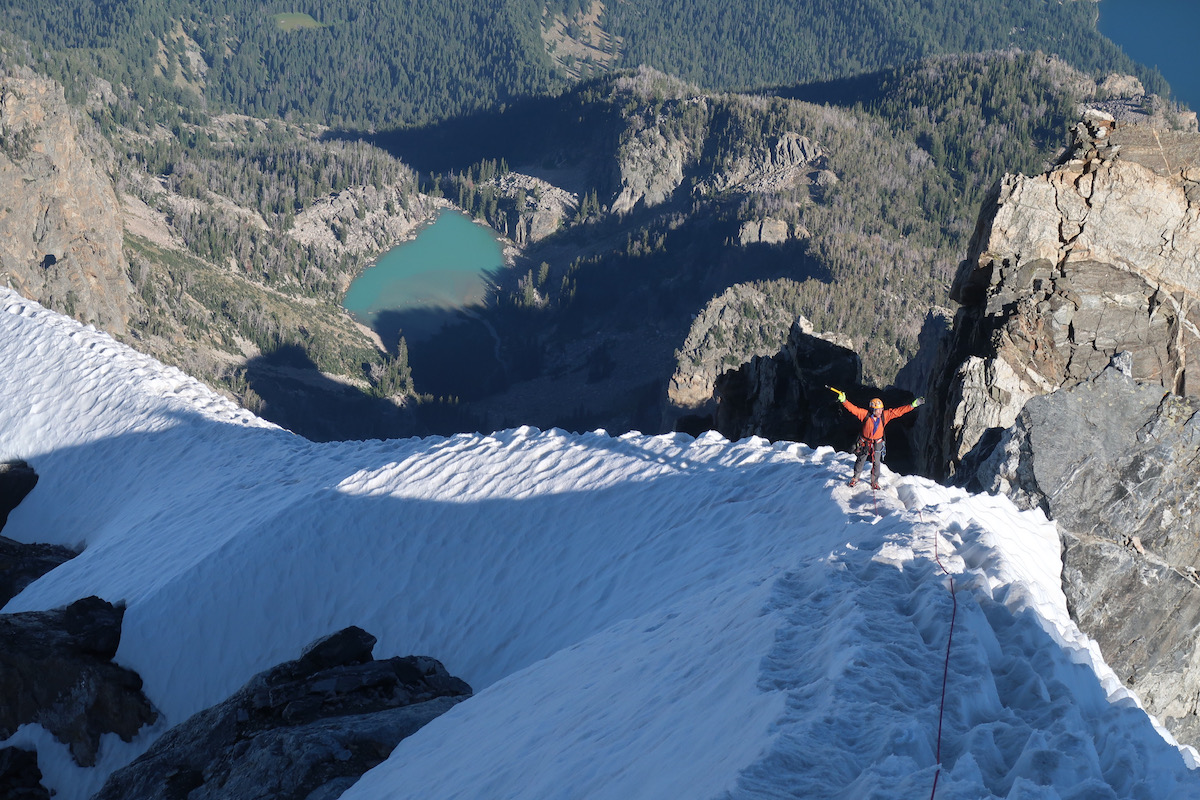 Jenkins enjoying himself on the upper snowfield of the Grand Teton's East Ridge after topping out the new route. [Photo] Justin Bowen