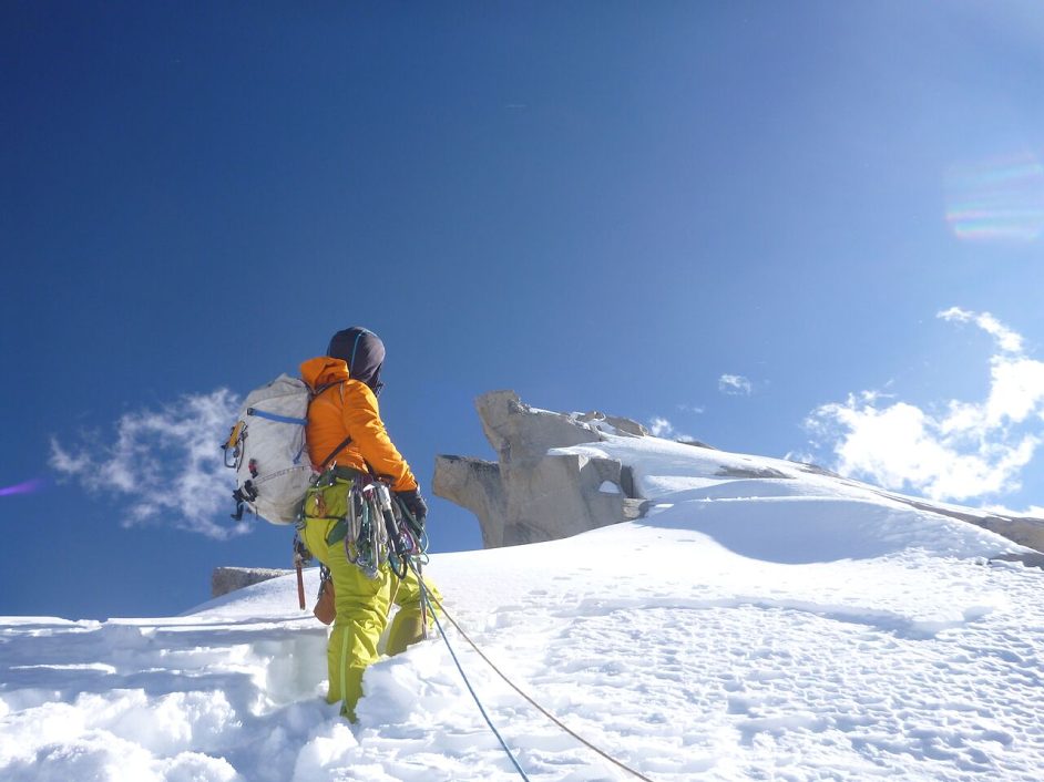 Hannam leads toward the summit. He turned around about 4 meters from where he is standing in the photo, approximately 20 meters below the summit. They stopped here out of respect for the local religion and because of dangerous granulated snow over seamless granite slabs. We left that to the gods of another time, Hannam wrote. [Photo] Rob Baker