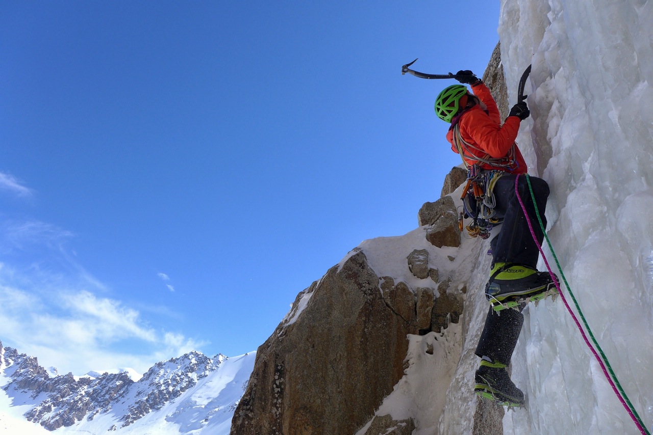 Papert swings into good ice about halfway up the new route. [Photo] Luka Lindic