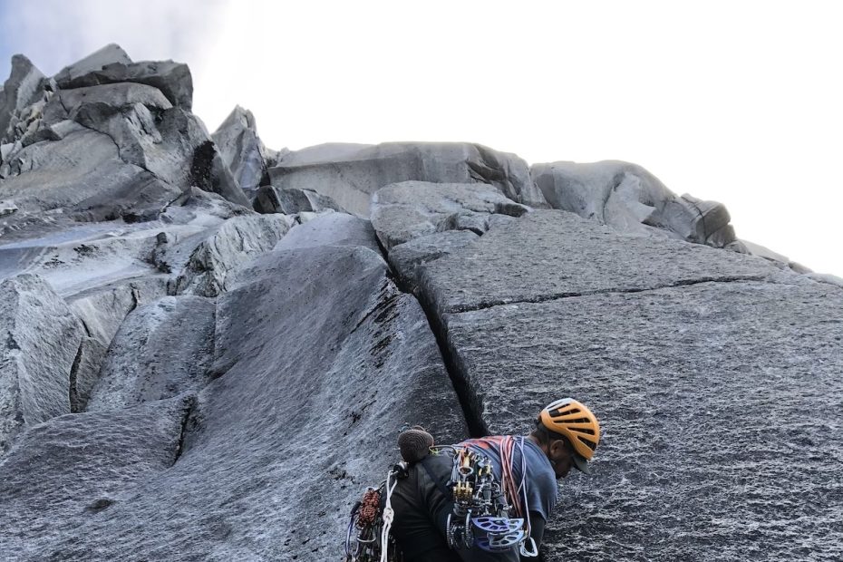 Chip Powell relishing the clean wide hand crack that marked the start of the headwall. [Photo] Chris Kalman