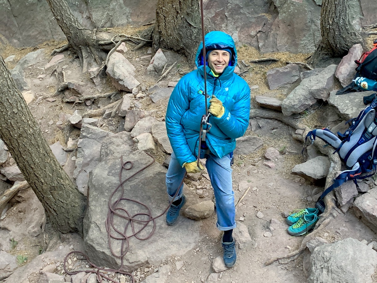 The author belays a climber in Boulder, Colorado's Flatirons last February while wearing the Phantom Down Parka. [Photo] Catherine Houston