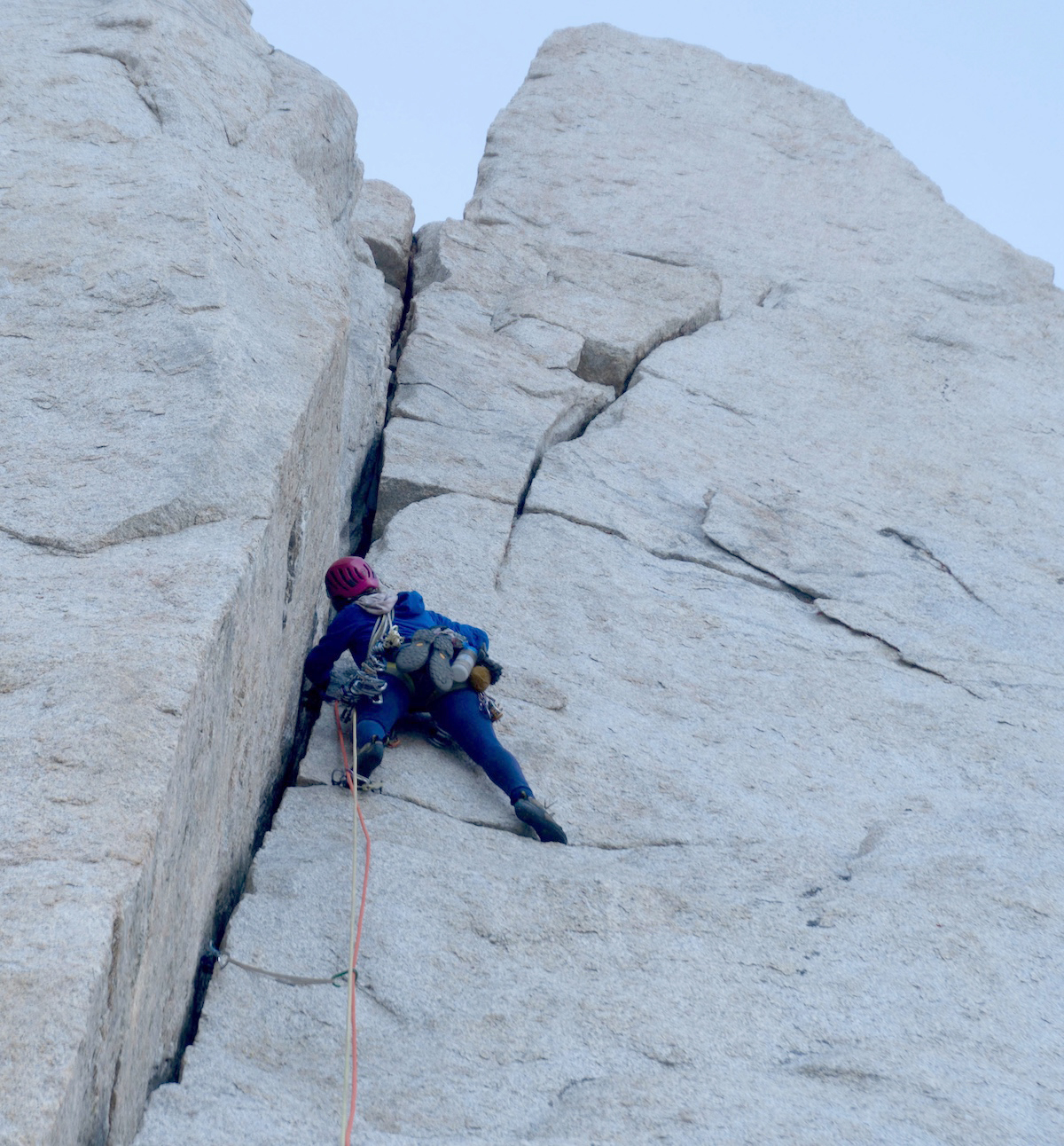Clark prepares to grovel through a wide crack while wearing the Patagonia Nano-Air Light Hoody, which stood up to the abuse. [Photo] Tad McCrea