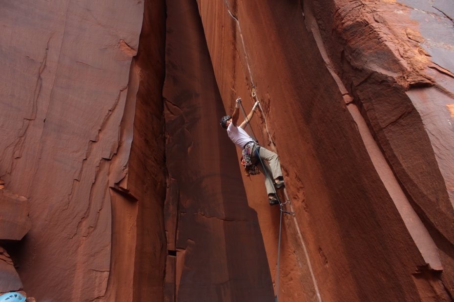 The author starts up Annunaki (5.11+) in Indian Creek, Utah, wearing the redesigned Petzl Sirocco helmet. [Photo] Macie Brendlinger