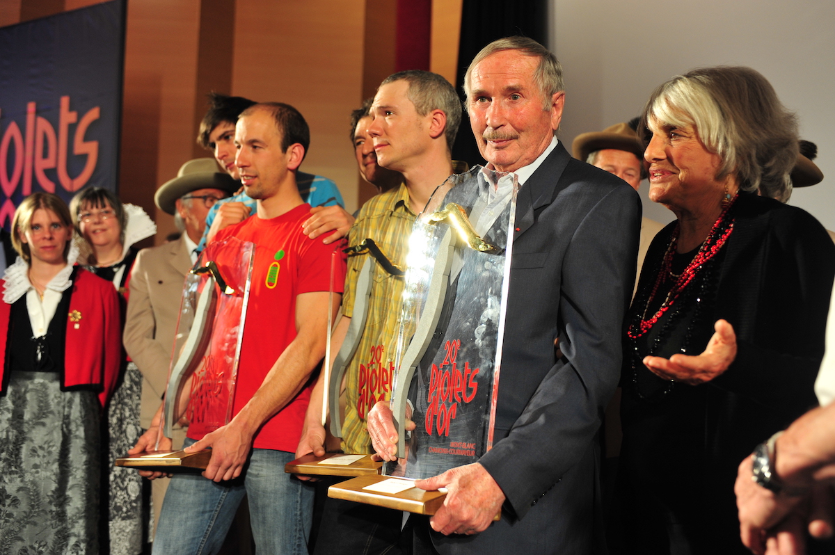 Paragot receiving the Piolets d'Or Lifetime Achievement (aka Walter Bonatti) Award in 2012. Rossana Podesta, Bonatti's partner of 30 years, is on the right. [Photo] Courtesy of Pascal Tournaire