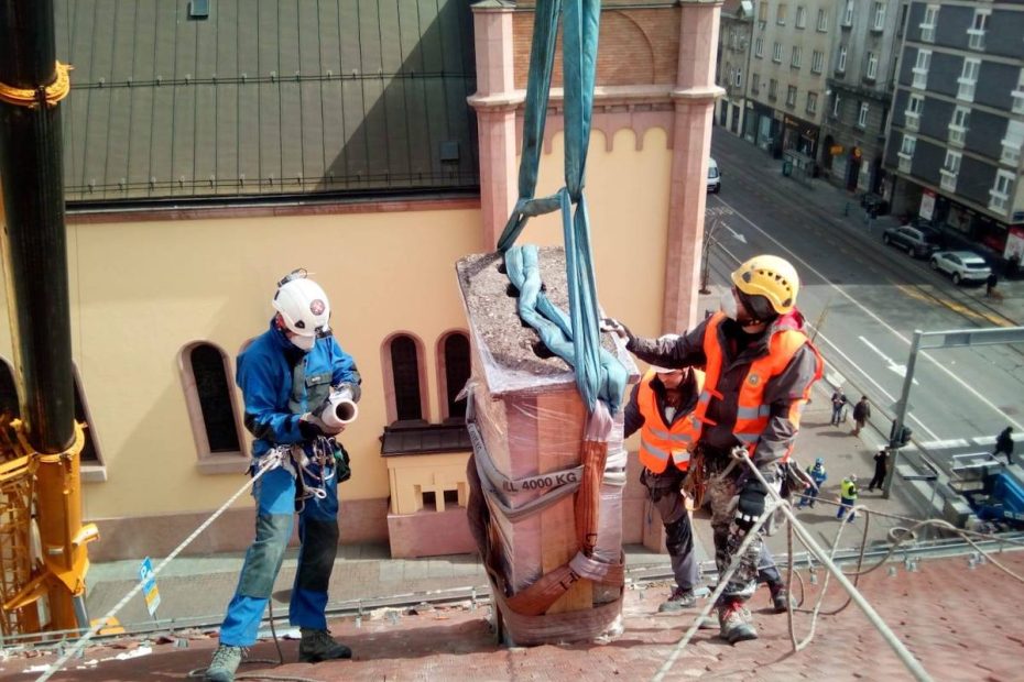 Jagor Koprek and two unidentified volunteers remove a damaged chimney above Vlaska Street in the center of Zagreb, Croatia. Koprek is one of the organizers of the volunteer movement to help clean up dangerous debris from city rooftops after the March 22 earthquake that rocked the country's capital. [Photo] Ivica Sturlan