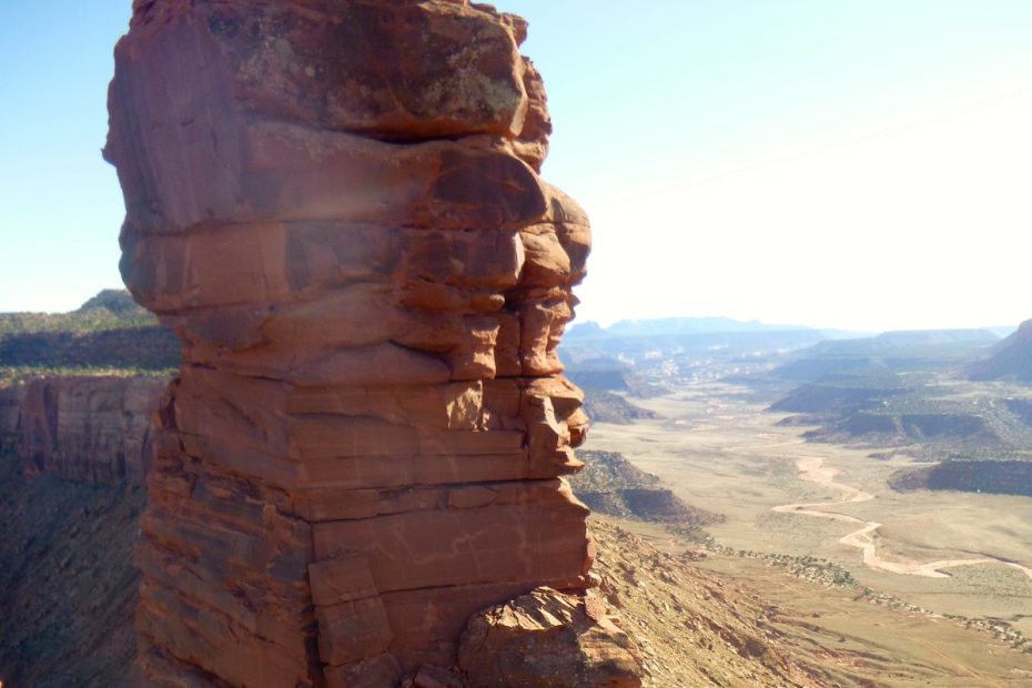 Ryan Franz down climbs from the summit of Bridger Jack Butte to access a rappel station in April 2015. The King of Pain pinnacle is in the background. The area is part of the Bears Ears National Monument designated by outgoing President Barack Obama on December 28, 2016. [Photo] Derek Franz