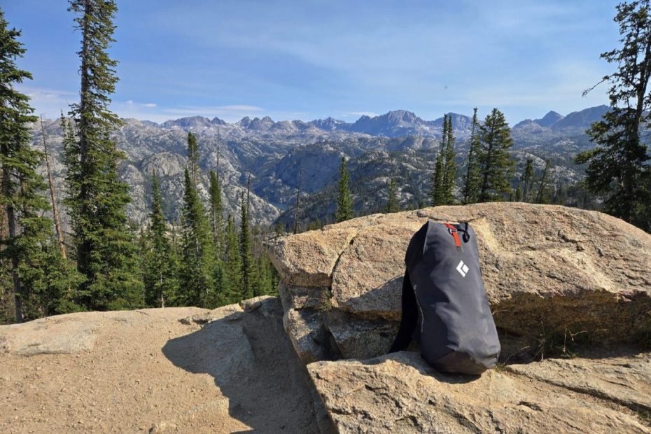 Black Diamond's Rock Blitz 15 leans back and takes a break with the Wind River Range and Continental Divide of Wyoming in the background. [Photo] Paul Rachele.